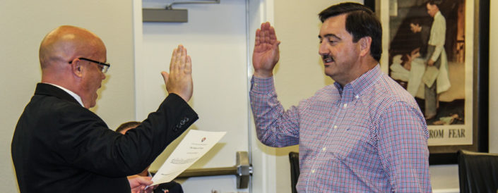 John Main gets sworn in by Rockwall County Judge David Sweet.