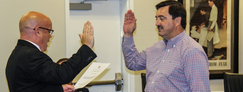 John Main gets sworn in by Rockwall County Judge David Sweet.