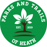 Parks and Trails of Heath Logo featuring a hand reaching out in the shape of a tree from the ground up with white leaves on the fingers and the words Parks And Trails of Heath Est. 2019 around the outside.