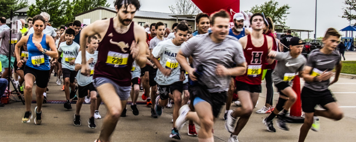 Runners starting the Heart of Heath 5k