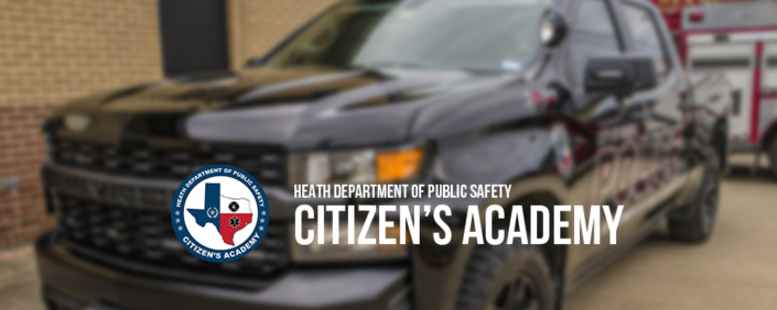 Promotional banner showing a blurred black police SUV parked outside a building, with a circular logo and the text ‘Heath Department of Public Safety Citizen’s Academy’ overlaid in the foreground.