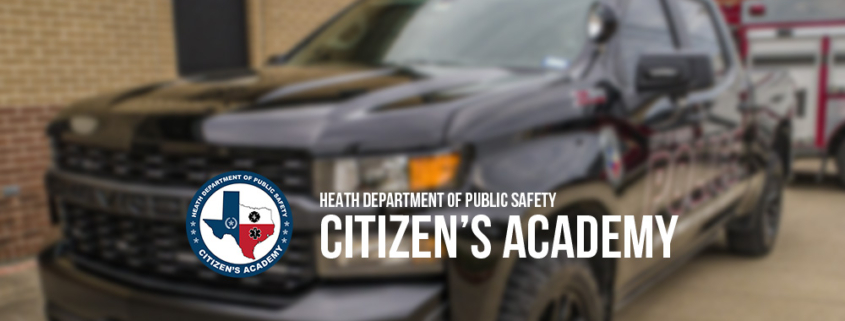 Promotional banner showing a blurred black police SUV parked outside a building, with a circular logo and the text ‘Heath Department of Public Safety Citizen’s Academy’ overlaid in the foreground.