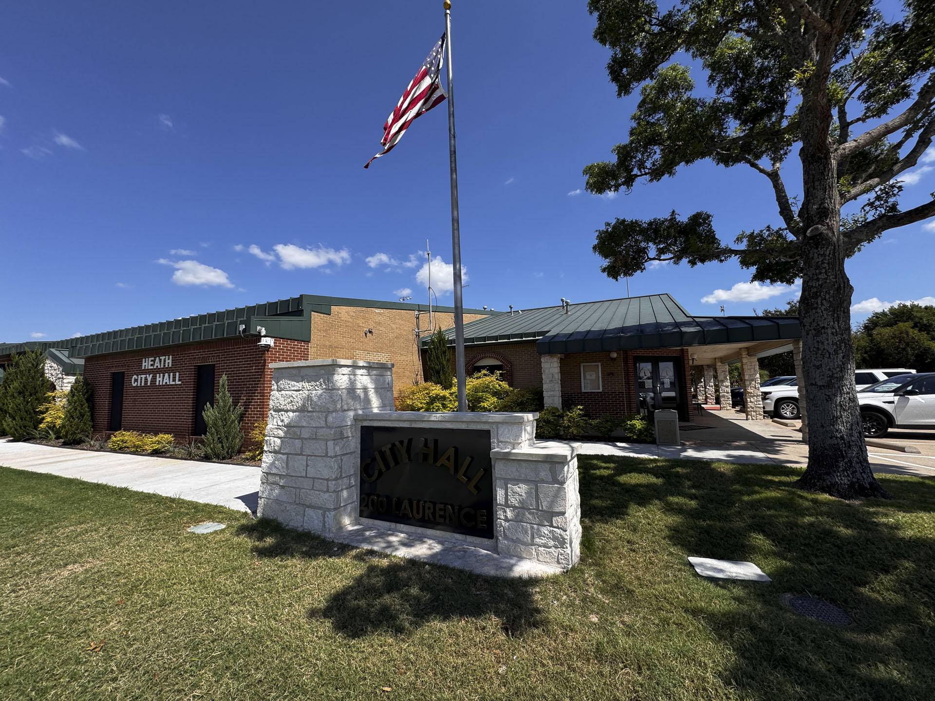 The front of City Hall showing the Stars and Stripes flagpole in the background.