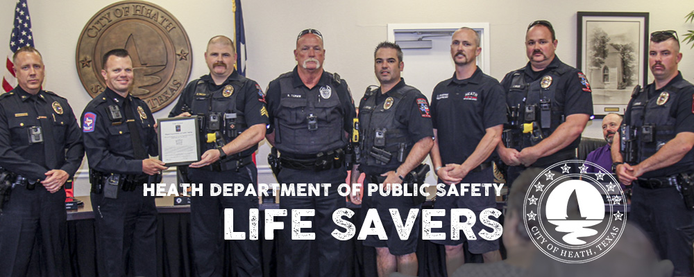 Officers of Heath DPS receiving award for saving life of a toddler.