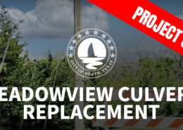 Entrance to Meadowview Road with a red banner saying"Project Complete".