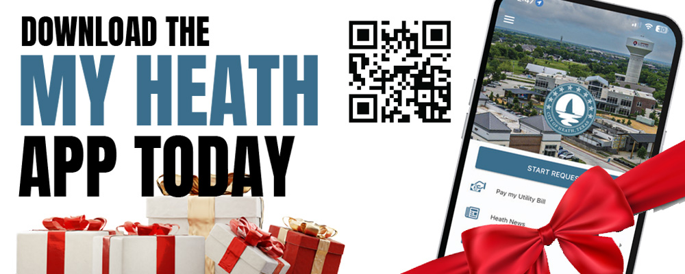 A mobile phone showing the My Heath App. The phone is wrapped in a red ribbon bow for Christmas.