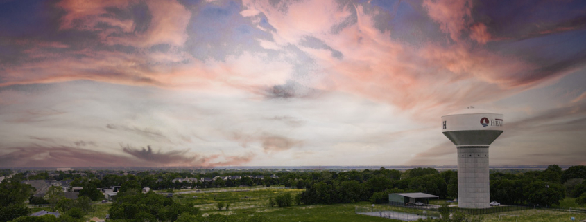 Sunset view of elevated North Water Tower in Heath, TX