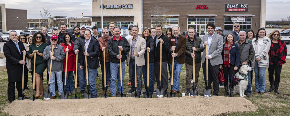 Participants with shovels at the Plaza Park groundbreaking.