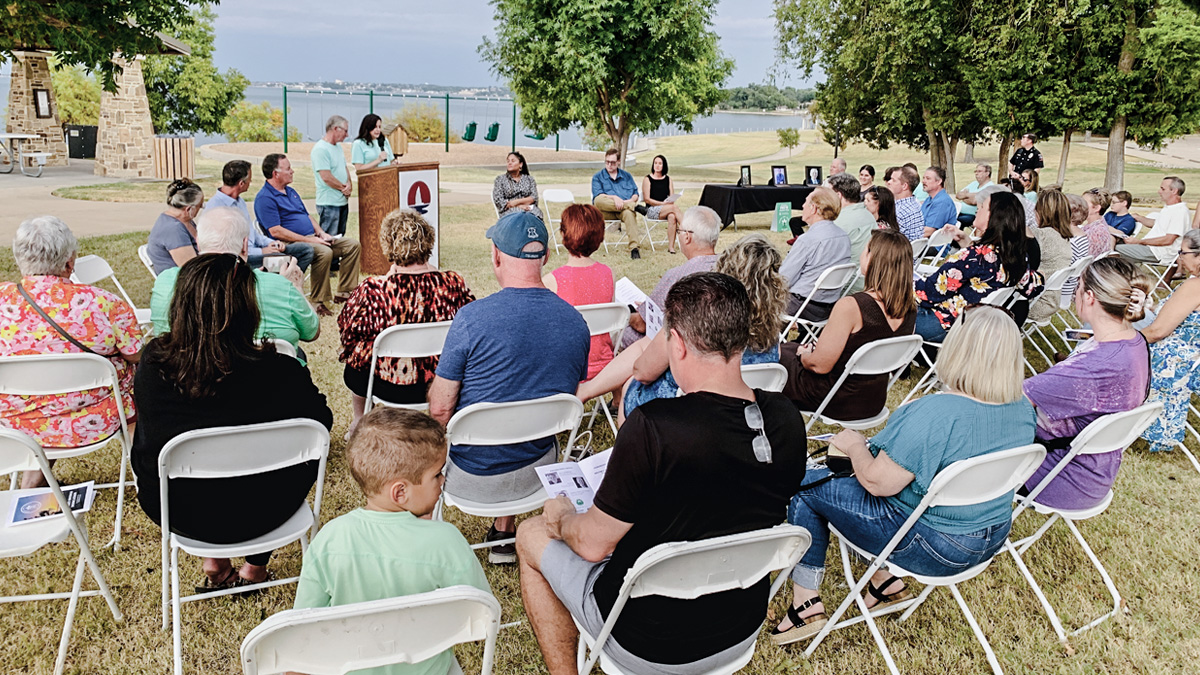 Crowd gathered for Sunset Swings Dedication.