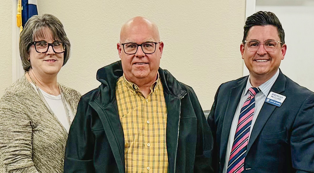 Kathy and Bob Tolbert with Heath City Mayor Jeremiah McClure.