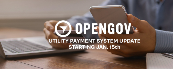Banner announcing an OpenGov utility payment system update starting January 15, showing a person holding a smartphone next to a laptop on a desk.