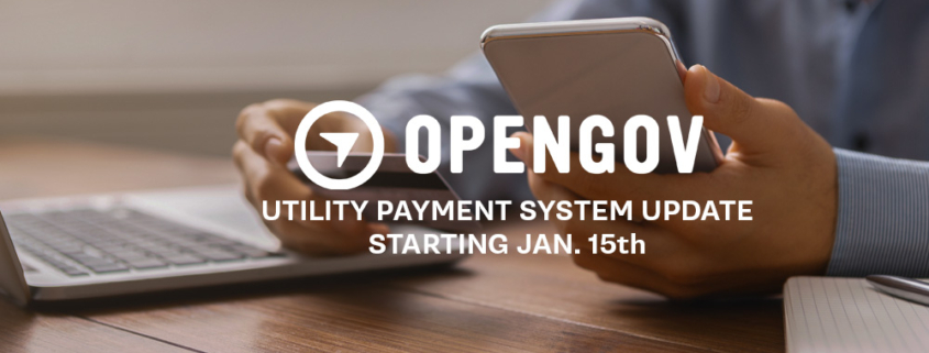 Banner announcing an OpenGov utility payment system update starting January 15, showing a person holding a smartphone next to a laptop on a desk.
