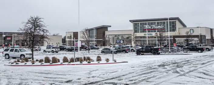 Tom Thumb parking lot covered with snow and the store in the background.
