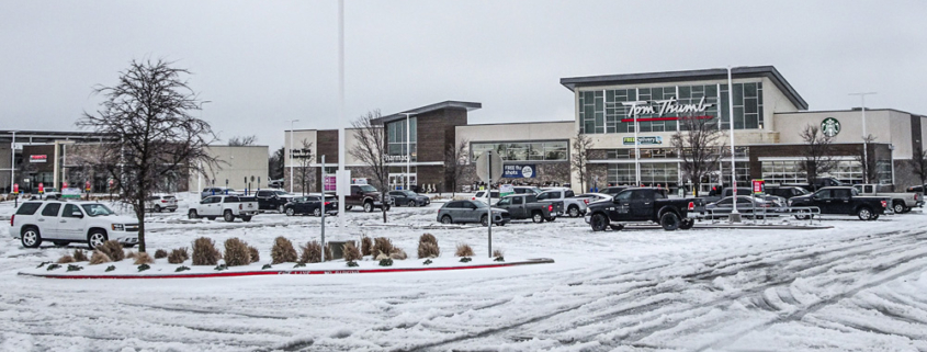 Tom Thumb parking lot covered with snow and the store in the background.