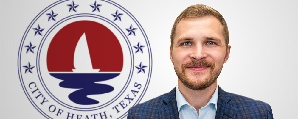 Headshot of Zack King, Director of Planning and Development, standing in front of the City of Heath, Texas official seal.